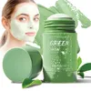A woman is applying a green face mask, with the product packaging prominently displayed. Náhled obrázku produktu
