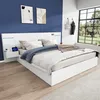 A modern bedroom with a white bed, blue wall, and large window. Produktbild-Vorschau