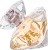 A close-up shot of a diamond-shaped perfume bottle with a light gold liquid inside. Produktbild-Vorschau