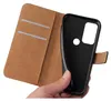 A hand holding a black phone case that is part of a brown flip cover case. The flip cover is open, showing card slots inside. Produktbild-Vorschau