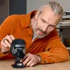 A man is assembling a LEGO Star Wars Kylo Ren helmet. Voir les images du produit