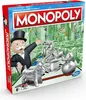 A Monopoly board game box with game pieces and the Monopoly man character. Produktbild-Vorschau