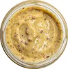 A close-up view of mustard in a glass jar. Produktbild-Vorschau
