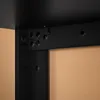 A close-up view of the black metal frame and corner joint of a table or shelf unit, showing several circular holes and screws. Produktbild-Vorschau