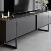 A modern gray media console with a television on top. Produktbild-Vorschau