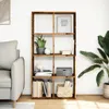 A bookshelf filled with books and decorative items, placed next to a sofa and a large plant. Náhled obrázku produktu