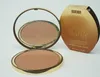 A bronzing powder compact and its packaging are displayed against a white background. Náhled obrázku produktu