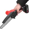 A hand holding a mini electric chainsaw. Produktbild-Vorschau
