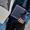 Two people are holding laptops. Produktbild-Vorschau