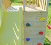 A close-up view of a wooden playground structure with a yellow slide and a climbing wall with colorful handholds. Podgląd zdjęcia produktu