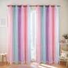 A room with two colorful curtains hanging in front of a window. Voir les images du produit