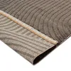 A close-up view of the corner of a rug, showing the texture and the underside. Anteprima dell’immagine prodotto