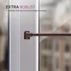 Close-up of a window or door frame with a brown bar attached. Anteprima dell’immagine prodotto