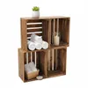 Four wooden crates stacked to form shelves, decorated with towels, a plant, and a candle. Náhled obrázku produktu