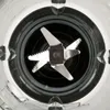 Close-up view of the blades inside a blender. Voir les images du produit