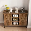 A sideboard cabinet with sliding barn doors, displaying kitchen appliances and dishes. Náhľad obrázku produktu
