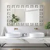 A modern bathroom vanity with two sinks and a large decorative mirror above. Náhled obrázku produktu