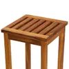 A close-up view of the top of a wooden stool. Náhled obrázku produktu