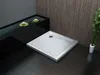 A modern bathroom with a shower tray, a water feature with lily pads, and bamboo plants. Produktbild-Vorschau