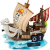 A 3D model of the Going Merry ship from One Piece, serving as a perpetual calendar, sits on a blue wave base. Náhled obrázku produktu
