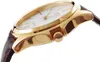 A close-up side view of a gold-toned watch with a white face and a brown leather strap. Anteprima dell’immagine prodotto