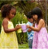 Three children are holding cups outdoors. Produktbild-Vorschau