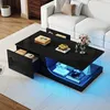 A modern living room scene with a black coffee table featuring LED lighting and storage, placed on a patterned rug in front of a white sofa. Anteprima dell’immagine prodotto