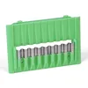 A green plastic kitchen gadget with metal blades. Produktbild-Vorschau
