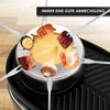 A raclette grill with various food items on forks dipped into cheese. Produktbild-Vorschau
