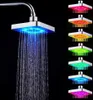 A shower head with LED lights showing different colors, with water flowing from it. Produktbild-Vorschau