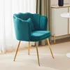 A teal velvet chair with gold legs is shown in a room with sheer curtains and a white cabinet in the background. Anteprima dell’immagine prodotto