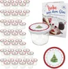 A collection of glass jars with lids, a recipe book, and a decorative plate, all with a Christmas theme. Produktbild-Vorschau
