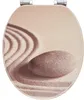 A toilet seat lid with a zen garden design. Produktbild-Vorschau