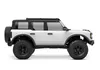 Side view of a white and black remote-controlled car. Produktbild-Vorschau