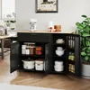 A black kitchen island with a wooden countertop, open doors revealing storage, and various kitchen items inside. Náhled obrázku produktu