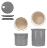 A collection of ceramic storage containers and lids, presented from various angles against a white background. Produktbild-Vorschau