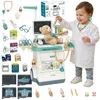 A child dressed as a doctor plays with a medical trolley toy. Anteprima dell’immagine prodotto
