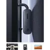 A black Ugreen Bluetooth receiver/transmitter with a 3.5mm jack is attached to a dark surface, likely a car interior or a piece of equipment. Anteprima dell’immagine prodotto