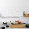 A kitchen counter with a table grill and ingredients. Produktbild-Vorschau