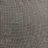 A close-up view of a gray fabric with a white polka dot pattern. Produktbild-Vorschau