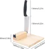 A kitchen tool with a knife mounted on a wooden base, with dimensions indicated by measurement lines and text. Náhled obrázku produktu
