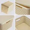 A collage of four images showing a beige plastic storage basket with a lid from different angles. Produktbild-Vorschau