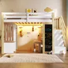 A child's loft bed with a desk, storage, and chalkboard, set up in a room. Voir les images du produit