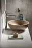 A modern bathroom sink with a chrome faucet, a textured ceramic basin, a small decorative vase with dried flowers, and a folded towel with a soap dish. Náhľad obrázku produktu