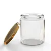 A clear glass jar with a gold lid, shown with the lid slightly ajar. Voir les images du produit