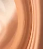 A close-up view of a product with a smooth, curved surface, showing subtle texture and reflections. A small, raised marking is visible on the surface. Anteprima dell’immagine prodotto