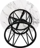 The underside of a round table with a marble-like top and a black metal base. Náhled obrázku produktu