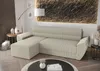A beige sectional sofa with a chaise lounge is shown in a living room setting. Náhľad obrázku produktu