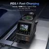 A black charging station with a digital display is placed on a laptop keyboard. Produktbild-Vorschau