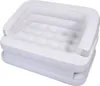 A white and gray inflatable sofa or air mattress, shown from a diagonal front-above angle on a white background. Náhled obrázku produktu